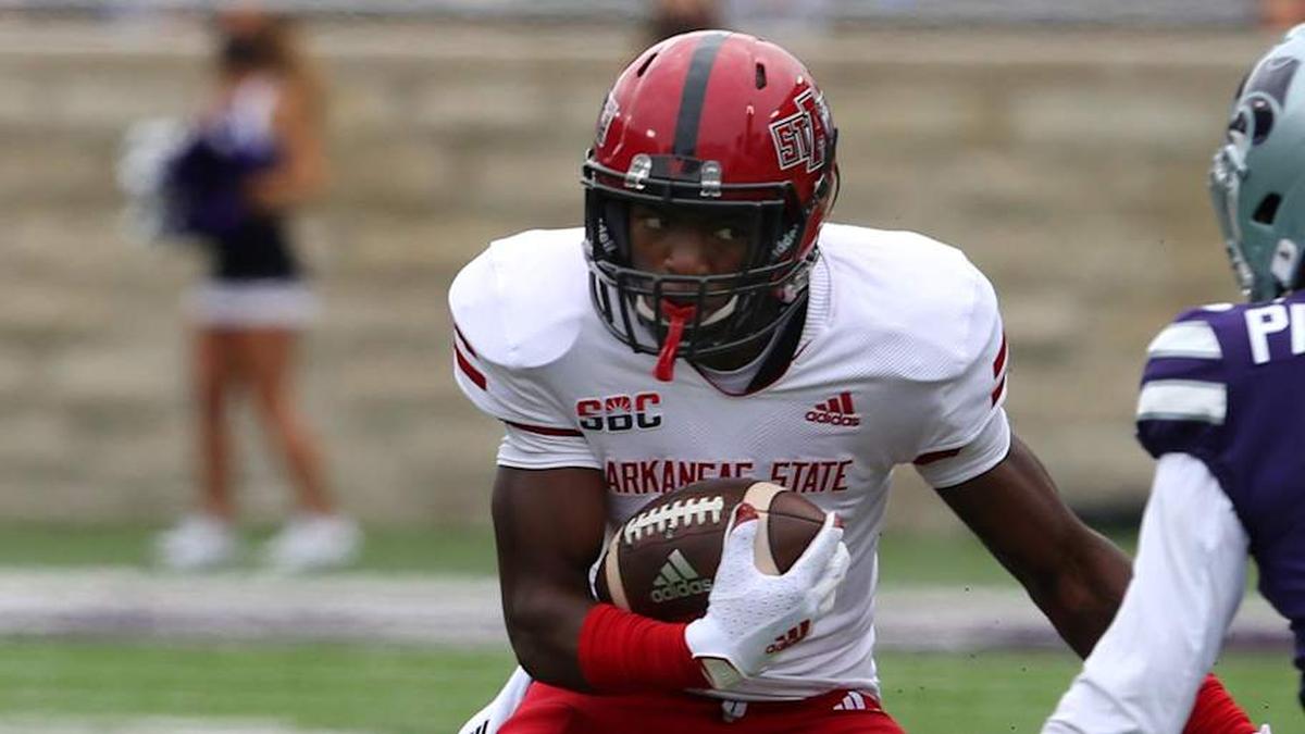  Sep 12, 2020; Manhattan, Kansas, USA; Arkansas State Red Wolves wide receiver Corey Rucker (7) looks for room to run against Kansas State Wildcats defensive back AJ Parker (12) during a game at Bill Snyder Family Football Stadium. Mandatory Credit: Scott Sewell-Imagn Images | Scott Sewell-Imagn Images 