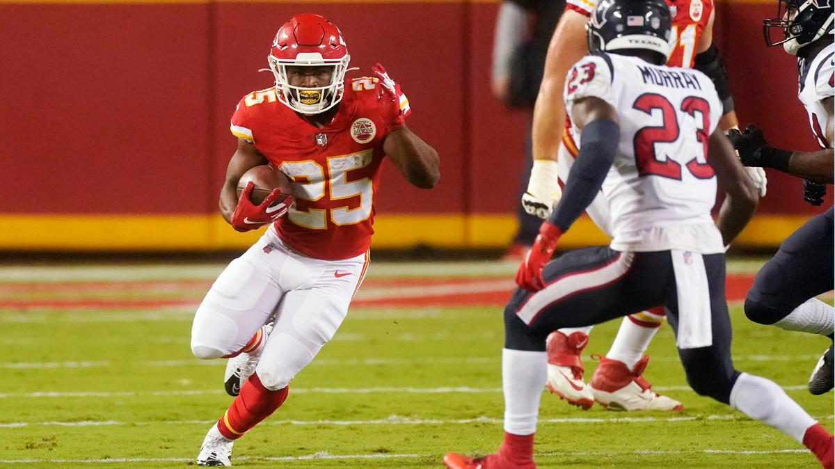 Kansas City Chiefs running back Clyde Edwards-Helaire (25) carries the ball against Houston Texans safety Eric Murray (23) in the first half of an NFL football game Thursday, Sept. 10, 2020, in Kansas City, Mo. (AP Photo/Charlie Riedel)