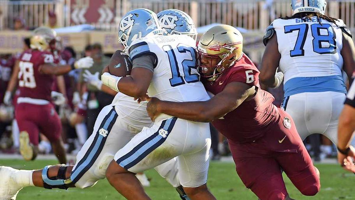  Nov 2, 2024; Tallahassee, Florida, USA; Florida State Seminoles defensive tackle Darrell Jackson Jr (6) sacks North Carolina Tarheels quarterback Jacolby Criswell (12) in the second quarter at Doak S. Campbell Stadium. Mandatory Credit: Robert Myers-Imagn Images | Robert Myers-Imagn Images 