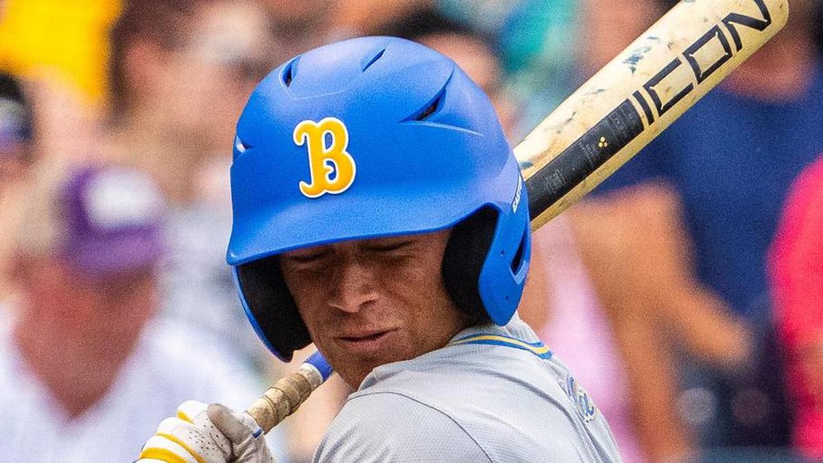  Jun 16, 2025; Omaha, Neb, USA; UCLA Bruins second baseman Phoenix Call (4) gets hit by a pitch during the second inning against the LSU Tigers at Charles Schwab Field. Mandatory Credit: Dylan Widger-Imagn Images | Dylan Widger-Imagn Images 