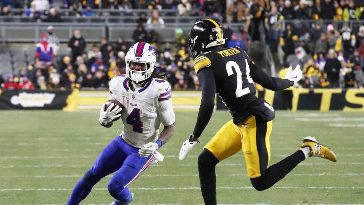  Nov 30, 2025; Pittsburgh, Pennsylvania, USA; Buffalo Bills running back James Cook (4) runs the ball as Pittsburgh Steelers cornerback Joey Porter Jr. (24) defends during the second quarter at Acrisure Stadium. Mandatory Credit: Charles LeClaire-Imagn Images | Charles LeClaire-Imagn Images 