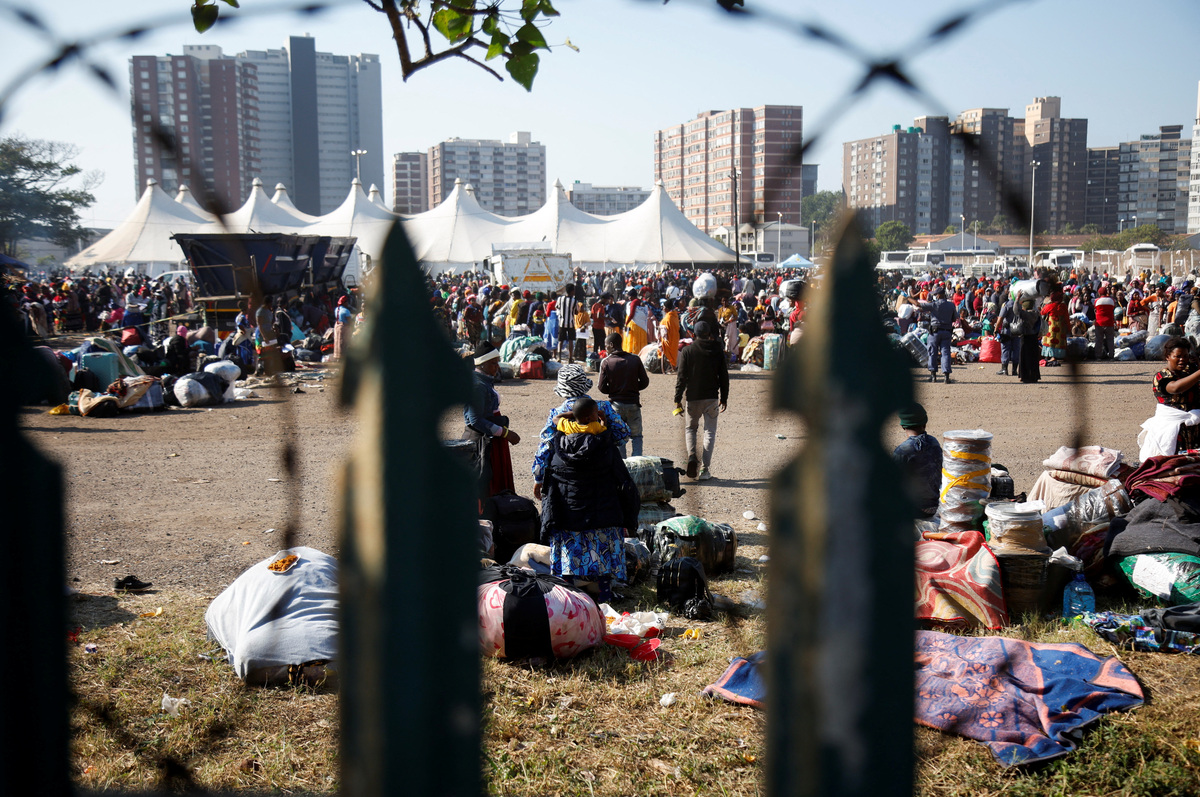 Malawi citizens seeking to return home wait to be processed by border officials in Durban, South Africa, June 25, 2026. REUTERS/Rogan Ward