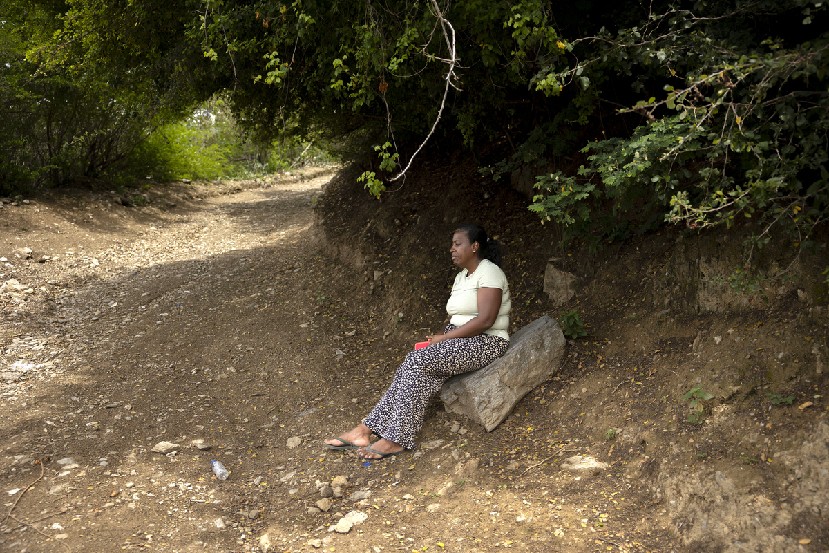 Laura Romero, the sister of Angel Romero, one of the earthquake's victims, sits outside Hotel Santuario La Llanada in La Guaira, Venezuela, on Tuesday, June 30, 2026. Many of the 146 Venezuelans deported from the United States were at this state-run holding facility the day the earthquakes struck and are now feared dead. (Fabiola Ferrero/The New York Times)