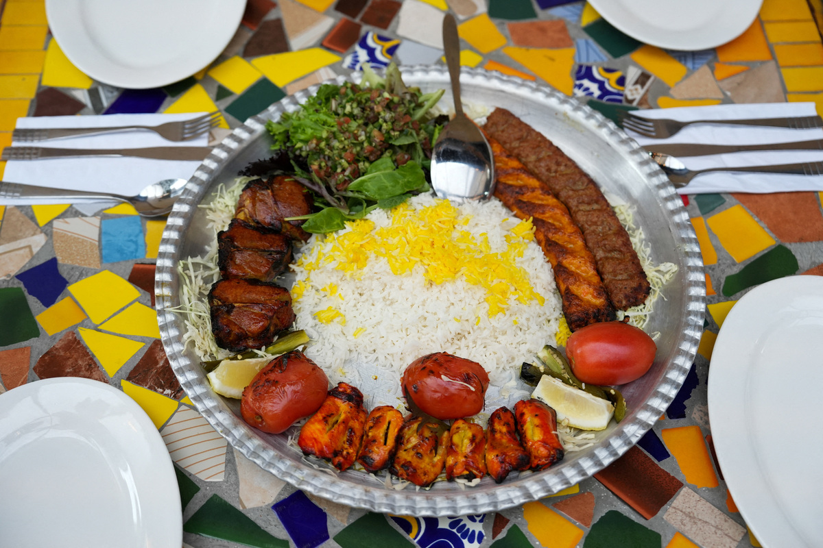 A dish of Persian kebabs is displayed at Comida Persa Iran, a restaurant owned by Iranian Saied Assadi, in Rosarito on the outskirts of Tijuana, where a small Iranian community reflects broader political divisions within the diaspora ahead of the team’s World Cup campaign, in Rosarito, Mexico, June 10, 2026. REUTERS/Aimee Melo
