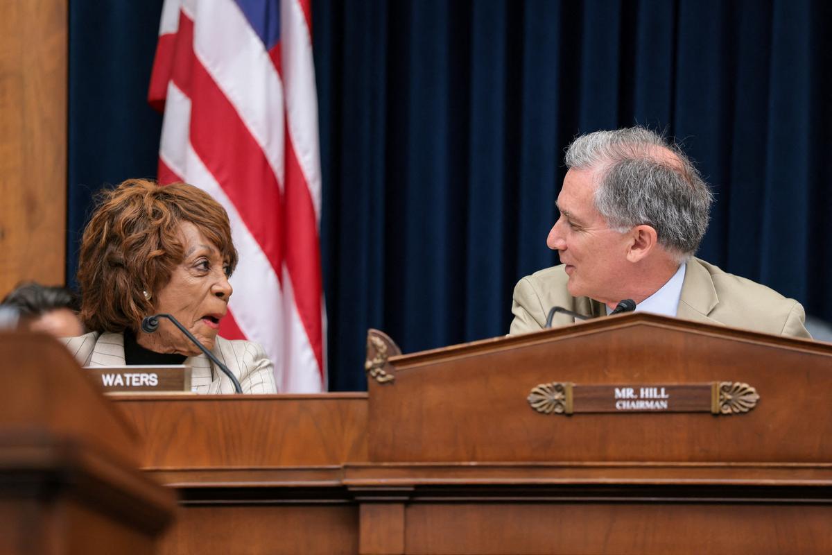 U.S. House Financial Services Committee Chairman French Hill (R-AR) and Ranking Member Maxine Waters (D-CA) look at each other during a committee hearing on oversight of prudential regulators, on Capitol Hill in Washington, D.C., U.S., June 4, 2026. REUTERS/Kylie Cooper