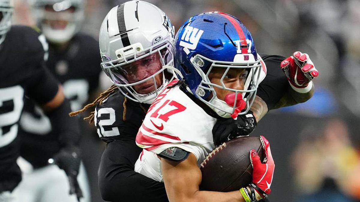  Dec 28, 2025; Paradise, Nevada, USA; New York Giants wide receiver Wan'Dale Robinson (17) is tackled by Las Vegas Raiders cornerback Eric Stokes (22) in the first quarter at Allegiant Stadium. Mandatory Credit: Stephen R. Sylvanie-Imagn Images | Stephen R. Sylvanie-Imagn Images 