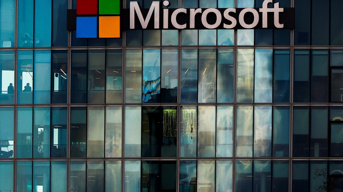 FILE PHOTO: A view shows a Microsoft logo at Microsoft offices in Issy-les-Moulineaux near Paris, France, January 9, 2025. REUTERS/Gonzalo Fuentes/File Photo