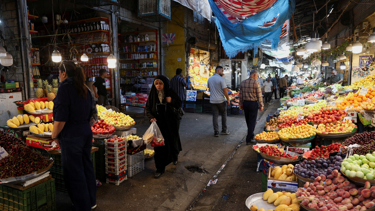 People walk in a local market in Tehran, Iran, June 11, 2026. Majid Asgaripour/WANA (West Asia News Agency) via REUTERS