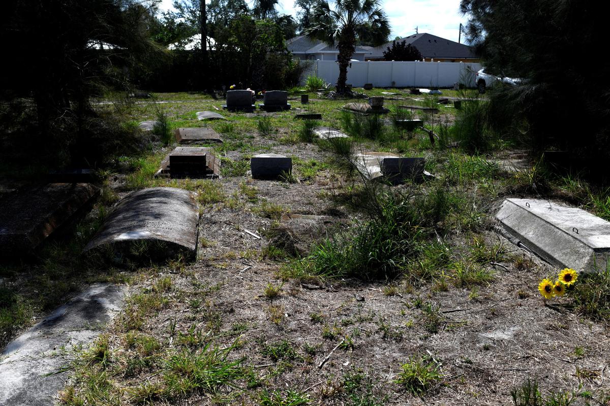 Graves at The Old Memphis Cemetery, a predominantly African-American cemetery, after the place was vandalized, with 17 gravesites and several headstones damaged in Palmetto, Florida, U.S., May 14, 2026. Authorities say “Trump” and “DeSantis” were spray-painted in red across several tombs as police continue investigating the incident. REUTERS/Octavio Jones