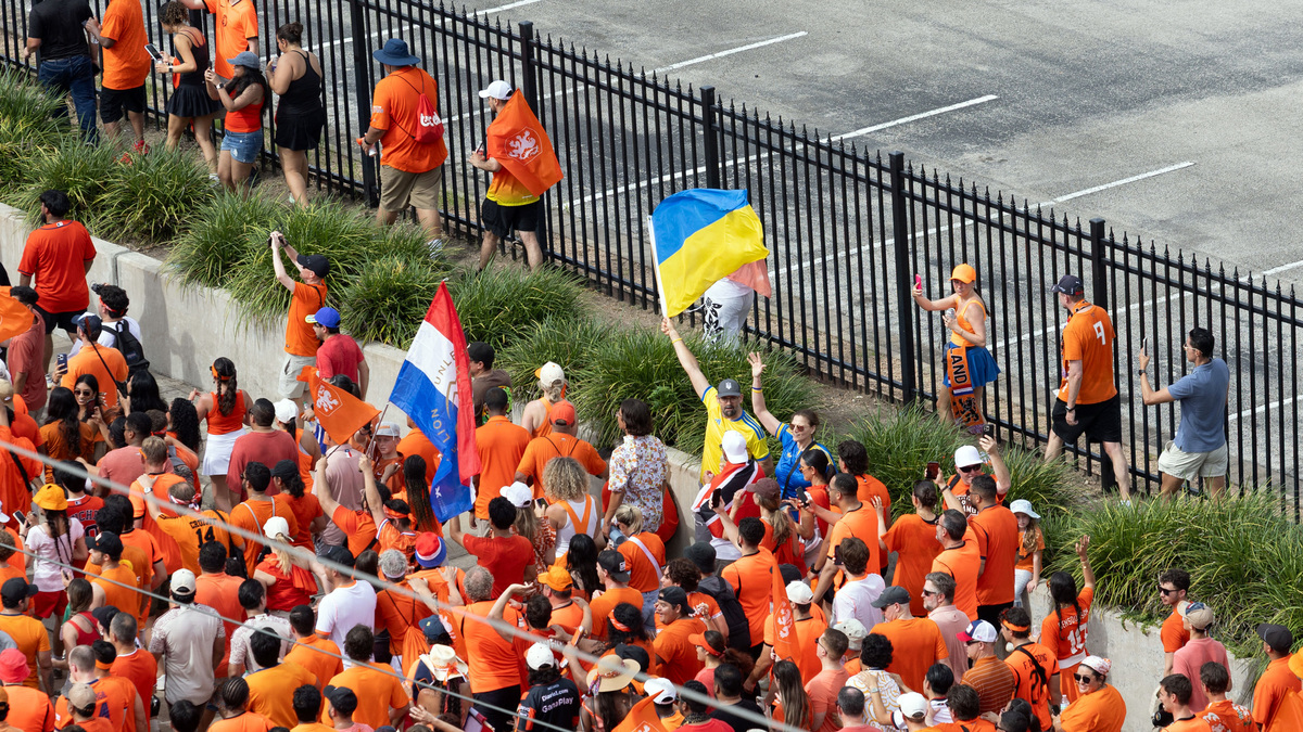 Soccer Football - FIFA World Cup 2026 - Group F - Netherlands v Sweden - Houston Stadium, Houston, Texas, U.S. - June 20, 2026 A Ukraine flag is held up as Netherlands fans gather on their way to the stadium before the match IMAGN IMAGES via Reuters/Joseph Buvid