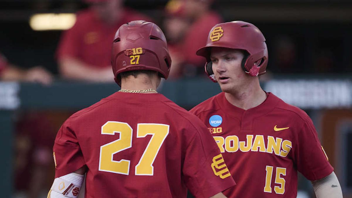  May 31, 2025; Corvallis, OR, USA; USC infielder Ethan Hedges (15) encourage infielder Bryce Martin-Grudzielanek (27) during the fifth inning after hitting his second home run of the game at the NCAA Corvallis Regional at Goss Stadium. Mandatory Credit: Troy Wayrynen-Imagn Images | Troy Wayrynen-Imagn Images 