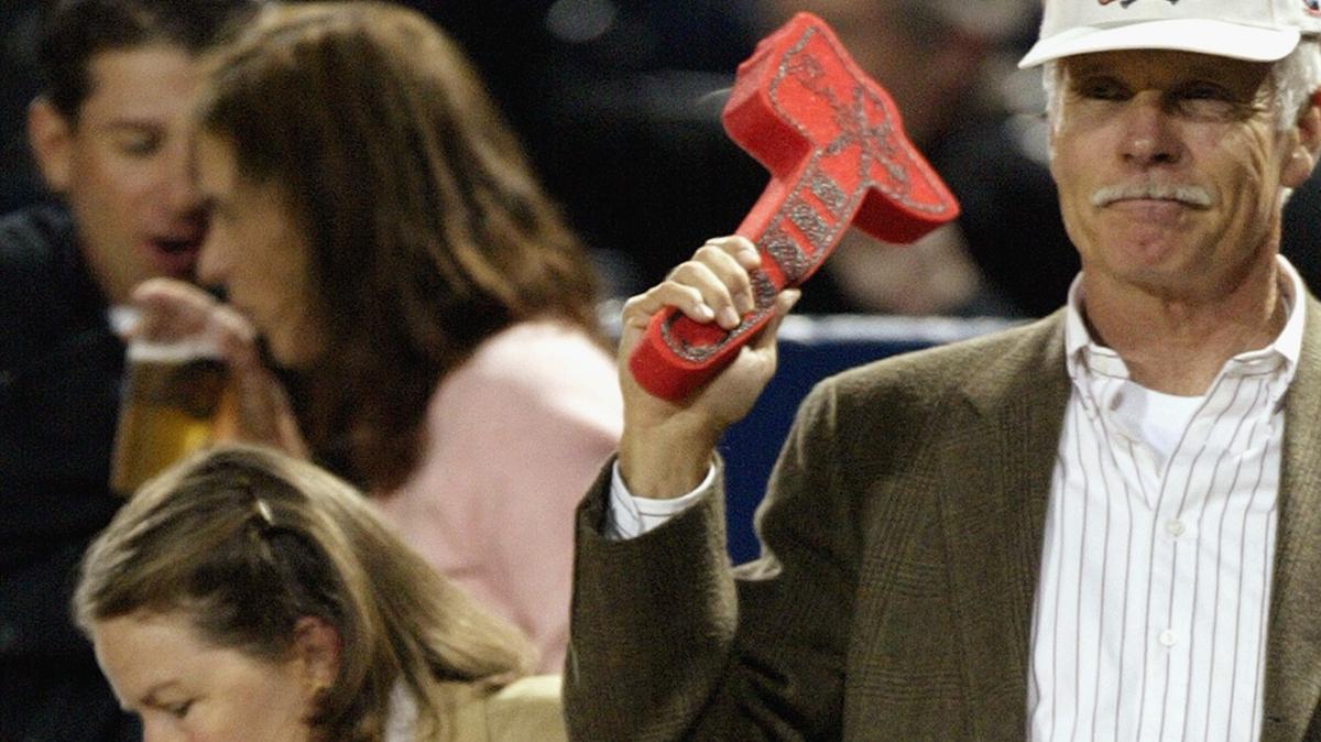 Former Atlanta Braves owner Ted Turner stands in the front row with a foam tomahawk during Game 1 of the National League Divisional Series against the Chicago Cubs on Sept. 30, 2003, at Turner Field in Atlanta.  (Craig Jones/Getty Images/TNS)