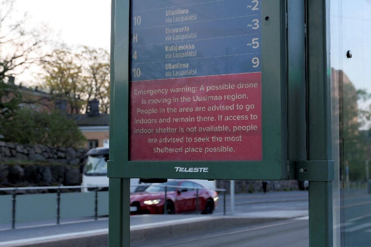 A warning about possible drone at a tram stop in Helsinki, Finland, May 15, 2026. Lehtikuva/Teemu Salonen/via REUTERS