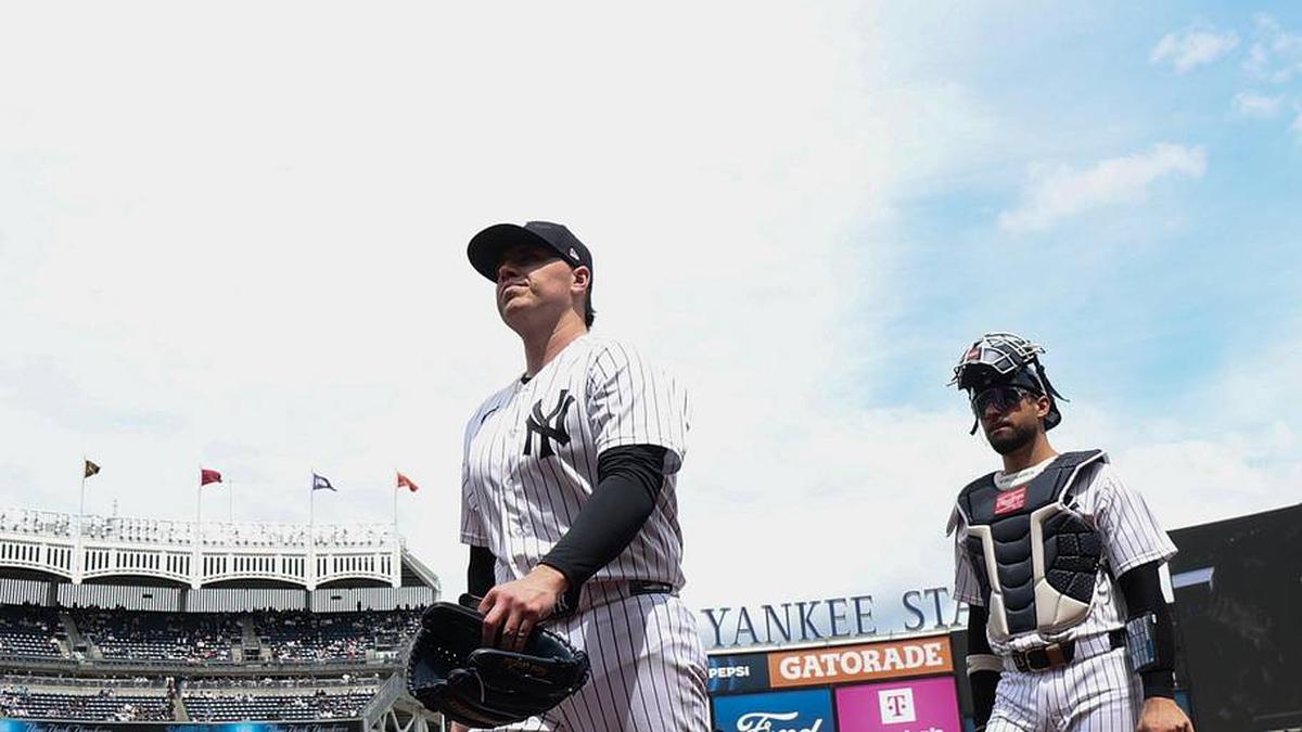  New York Yankees pitcher Ryan Weathers (40) and catcher J.C. Escarra (25) walk in before the game against the Baltimore Orioles at Yankee Stadium. | Vincent Carchietta-Imagn Images 