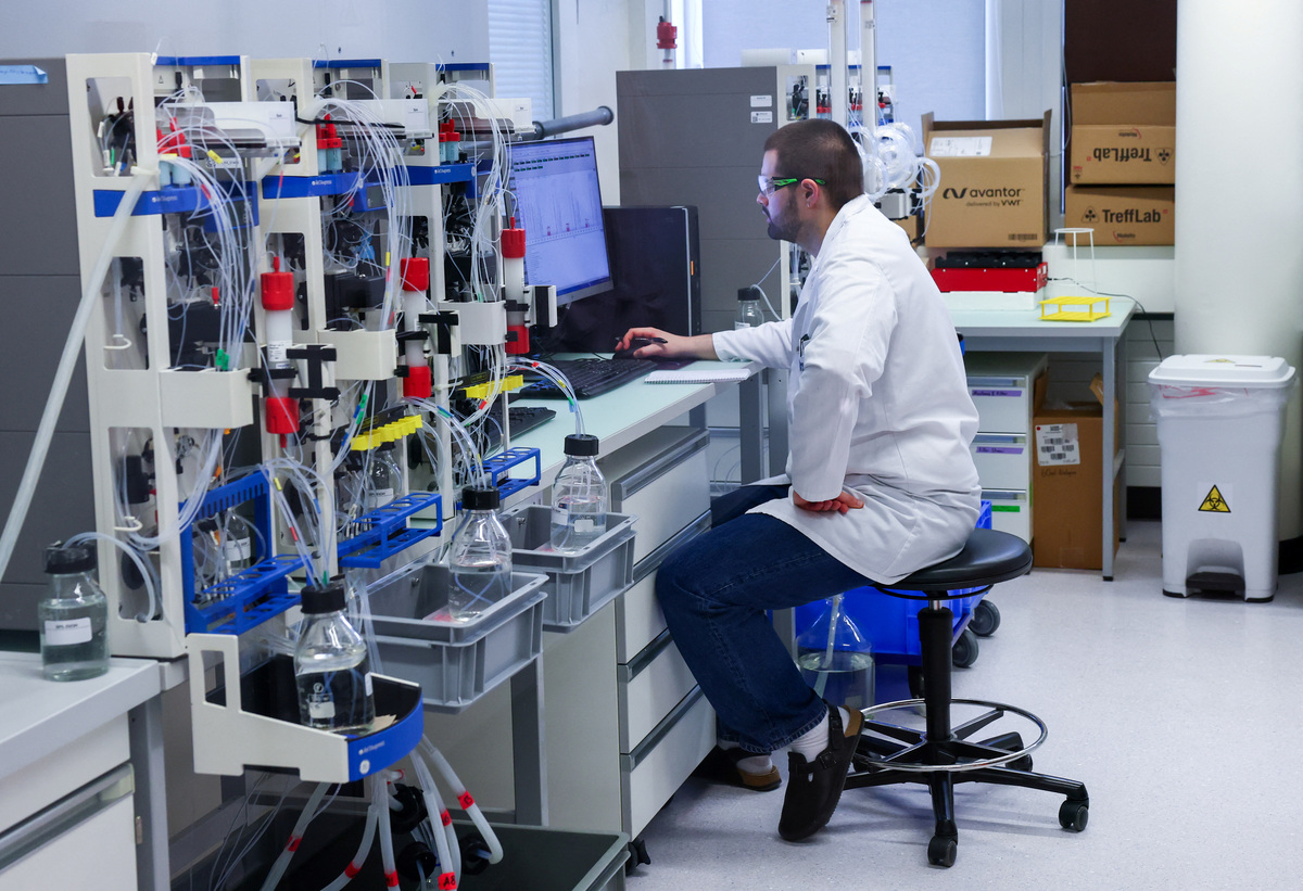 A staff member works in the akta laboratory at Molecular Partners, a biotech company specialising in custom‑built DARPin therapeutics, ahead of a June 14 vote on a plan backed by the right‑wing party to limit population growth to 10 million inhabitants, in Schlieren near Zurich, Switzerland, May 28, 2026. REUTERS/Denis Balibouse