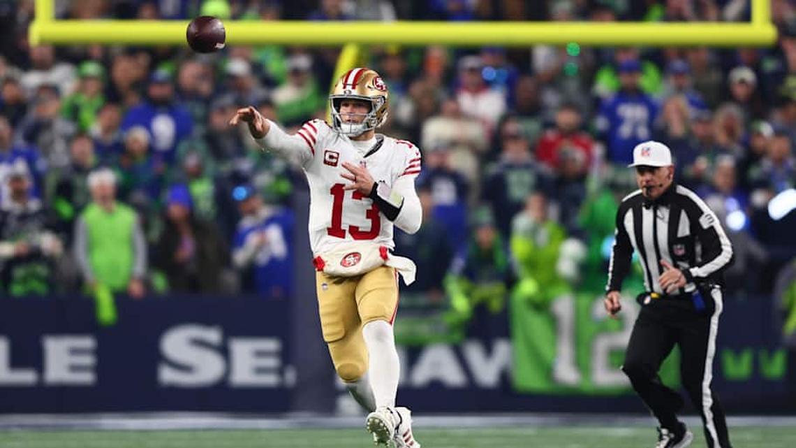  Jan 17, 2026; Seattle, WA, USA; San Francisco 49ers quarterback Brock Purdy (13) throws downfield against the Seattle Seahawks during the first half in an NFC Divisional Round game at Lumen Field. Mandatory Credit: Kevin Ng-Imagn Images | Kevin Ng-Imagn Images 
