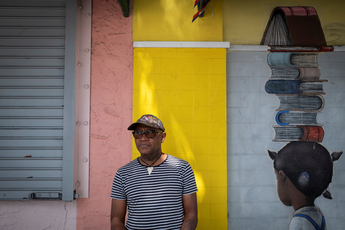 Patrick Noze, a Haitian artist, poses for a portrait in the Little Haiti neighborhood in Miami, Florida, U.S., June 26, 2026. REUTERS/Marco Bello