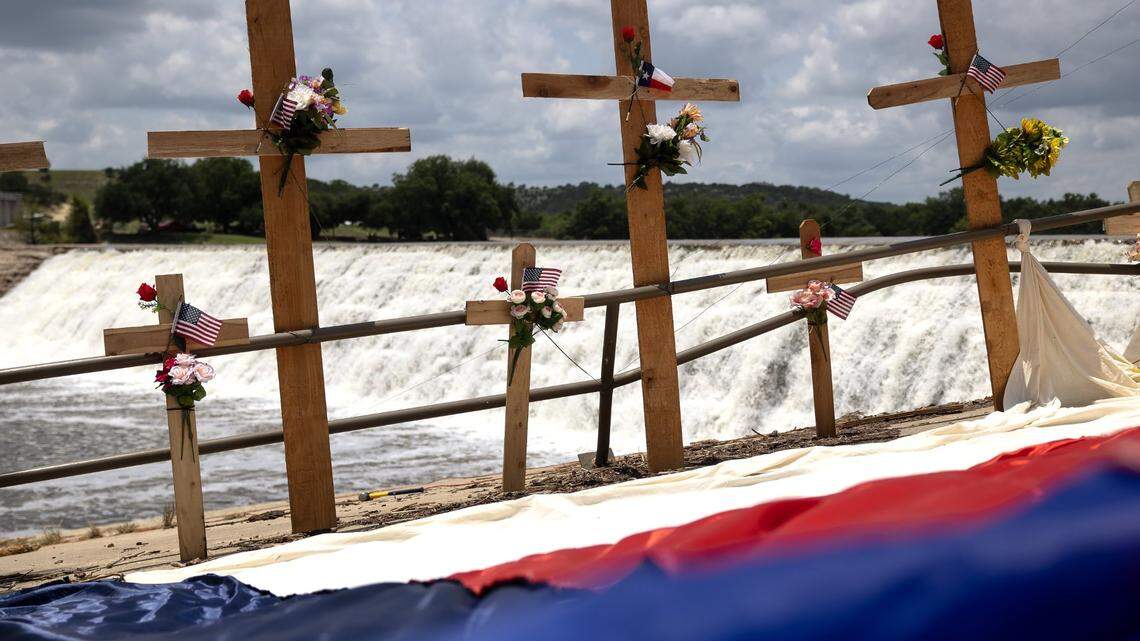 Wooden crosses are erected on the bank of the Guadalupe River to honor the victims of a deadly flood in Kerrville, Texas, on July 12, 2025.