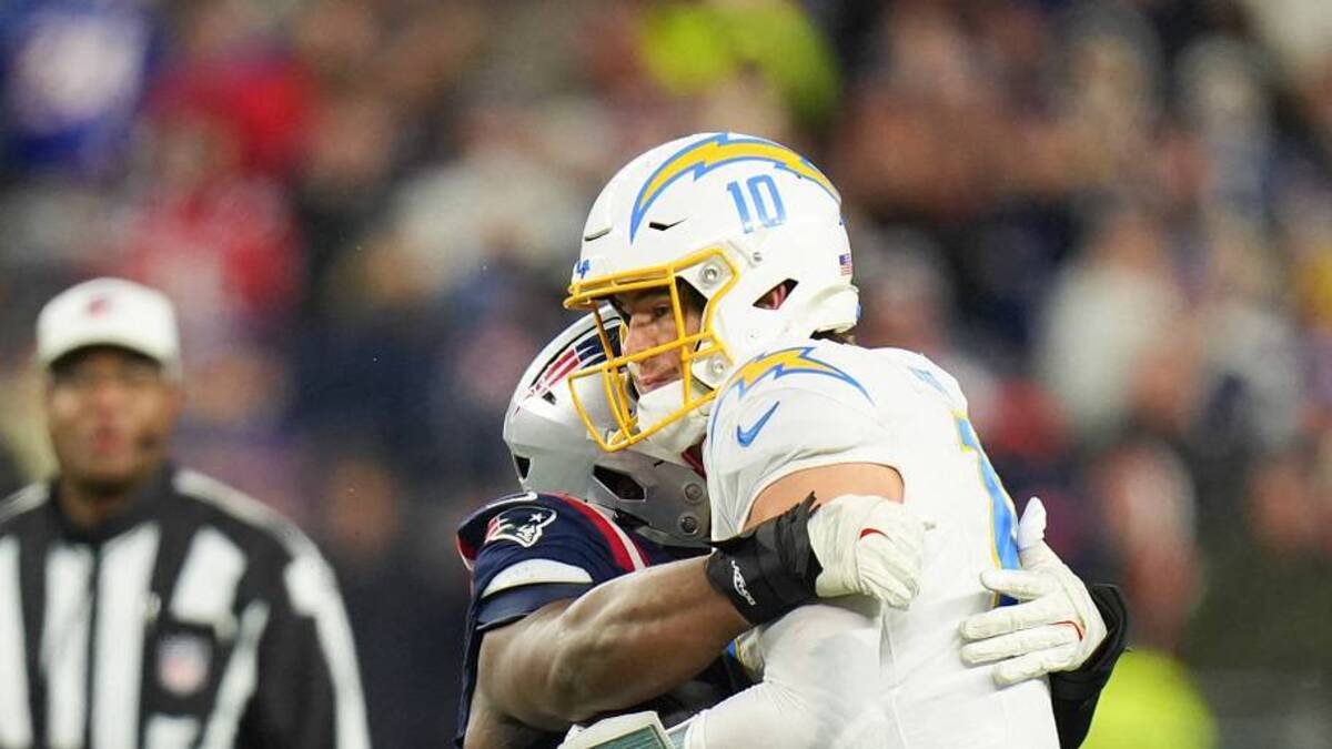  Jan 11, 2026; Foxborough, MA, USA; New England Patriots defensive end Milton Williams (97) sacks Los Angeles Chargers quarterback Justin Herbert (10) during the fourth quarter in an AFC Wild Card Round game at Gillette Stadium. Mandatory Credit: David Butler II-Imagn Images | IMAGN IMAGES via Reuters Connect 