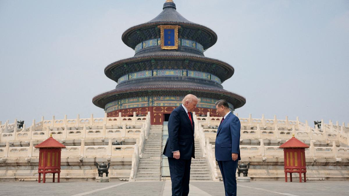 President Trump and Chinese President Xi Jinping stand together as they tour the Temple of Heaven in Beijing, May 14.  REUTERS/Evan Vucci