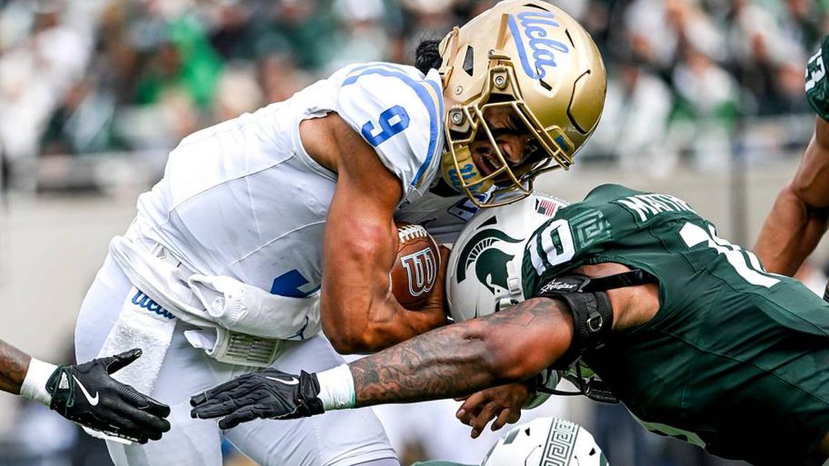  Michigan State's Wayne Matthews III, right, tackles UCLA's Nico Iamaleava during the second quarter on Saturday, Oct. 11, 2025, at Spartan Stadium in East Lansing. | Nick King/Lansing State Journal / USA TODAY NETWORK via Imagn Images 