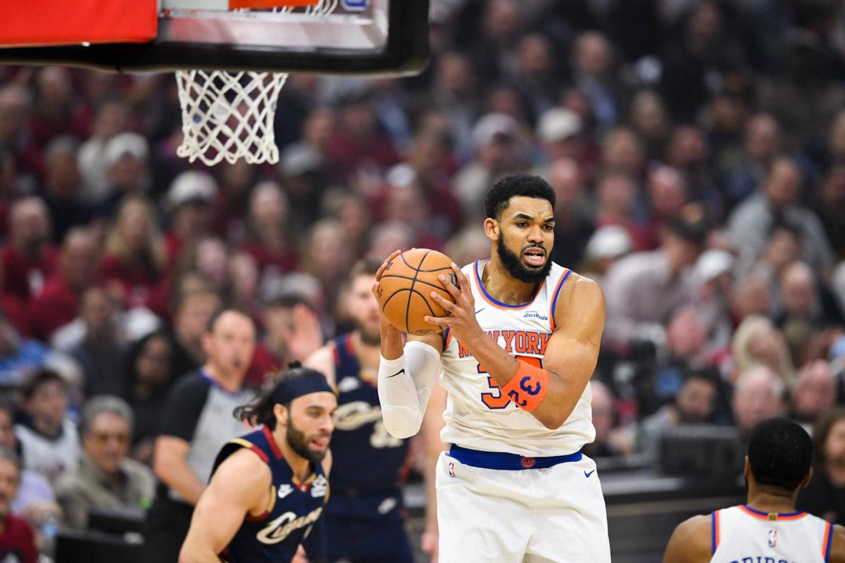  May 25, 2026; Cleveland, Ohio, USA; New York Knicks center Karl-Anthony Towns (32) rebounds in the first quarter against the Cleveland Cavaliers during game four of the eastern conference finals for the 2026 NBA playoffs at Rocket Arena. Mandatory Credit: David Richard-Imagn Images 