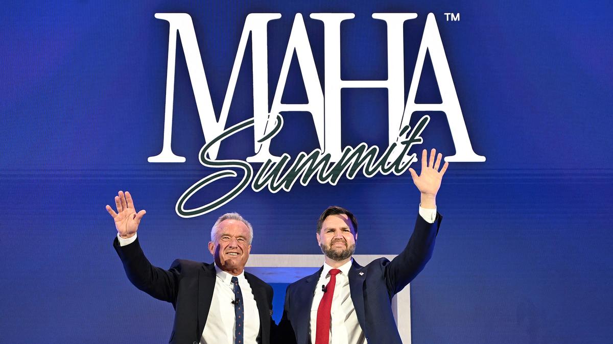 From left to right: US Secretary of Health and Human Services Robert F. Kennedy Jr. and Vice President JD Vance wave to the audience during the Make America Healthy Again (MAHA) summit in Washington, D.C., on Nov. 12, 2025. (Alex Wroblewski/AFP/Getty Images/TNS)
