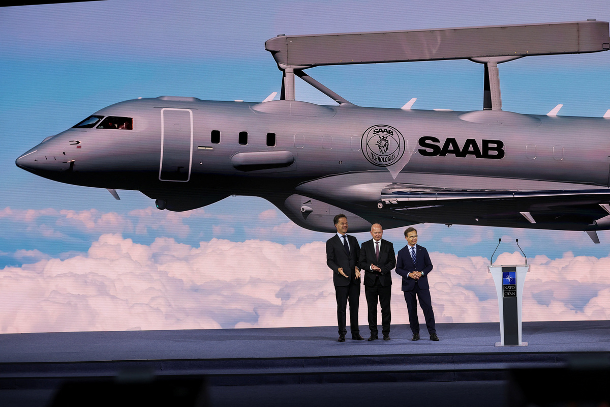 President and CEO of Saab Micael Johansson stands flanked by Sweden's Prime Minister Ulf Kristersson and NATO Secretary General Mark Rutte during the High Level Defence announcements at the NATO Summit Defence Industry Forum, on the sidelines of the NATO leaders' Summit, in Ankara, Turkey, July 7, 2026. REUTERS/Yves Herman
