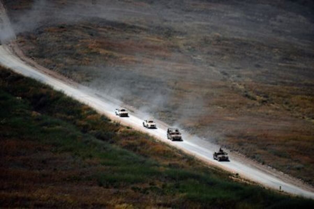 Israeli military vehicles drive on a Lebanese road by the Israel-Lebanon border, as seen from northern Israel, June 18, 2026. REUTERS/Gil Eliyahu