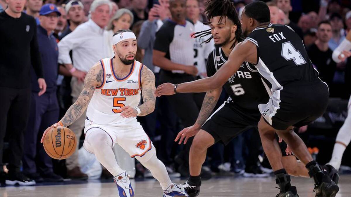  New York Knicks guard Jose Alvarado (5) controls the ball against San Antonio Spurs guard Stephon Castle (5) and guard De'aaron Fox (4) during the fourth quarter of game four of the 2026 NBA Finals at Madison Square Garden. Mandatory Credit: Brad Penner-Imagn Images | Brad Penner-Imagn Images 