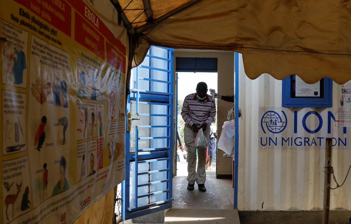 A man walks through a temperature checkpoint, after Uganda closed its borders with the Democratic Republic of Congo, as authorities intensify efforts to contain a new Ebola outbreak caused by the Bundibugyo virus strain, at the Mpondwe border post, in Kasese district, Uganda, May 28, 2026. REUTERS/Abubaker Lubowa