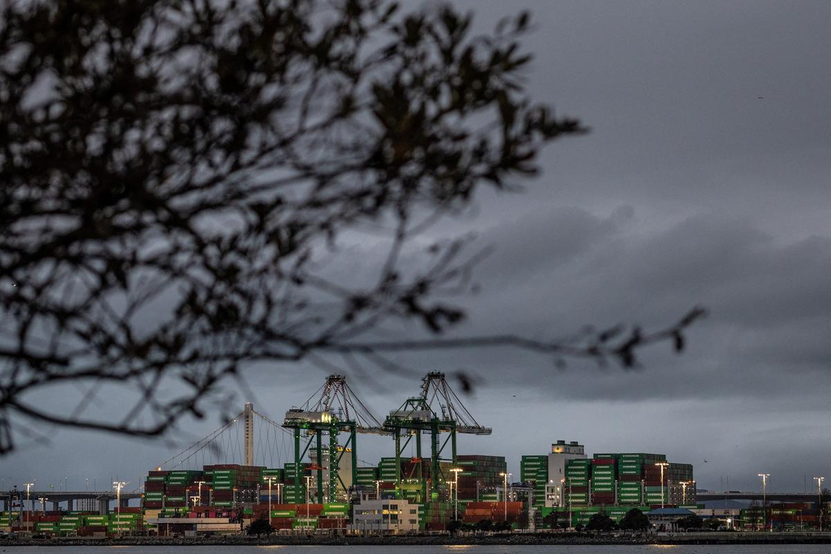 Shipping containers are stacked up at the port of Oakland following the Supreme Court's ruling that Trump had exceeded his authority when he imposed tariffs, in Oakland, California, U.S., February 24, 2026. REUTERS/Carlos Barria