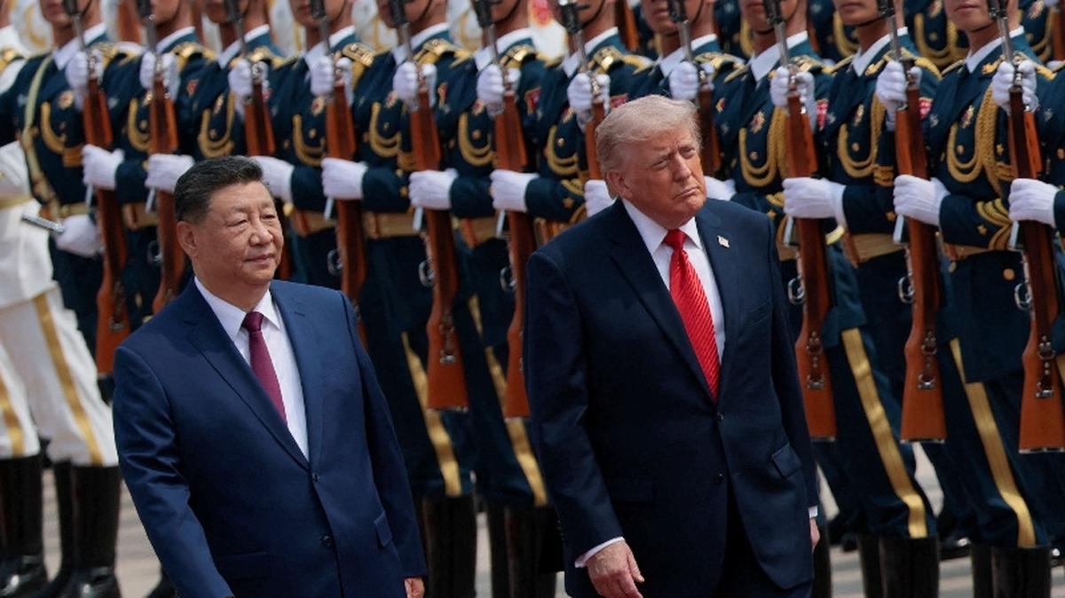 President Trump inspects an honor guard during his welcome ceremony at the Great Hall of the People, May 14.  REUTERS/Evan Vucci