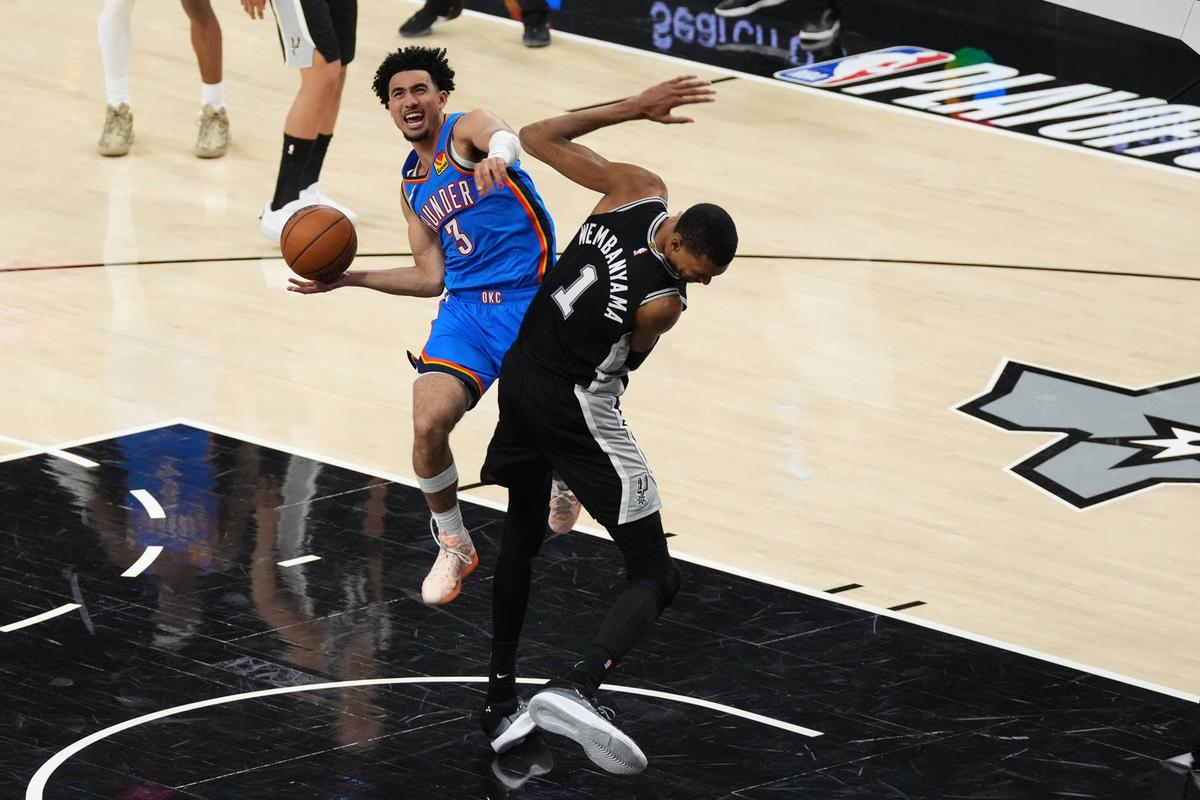  Oklahoma City Thunder guard Jared McCain (3) makes a layup on San Antonio Spurs forward Victor Wembanyama Scott Wachter-Imagn Images