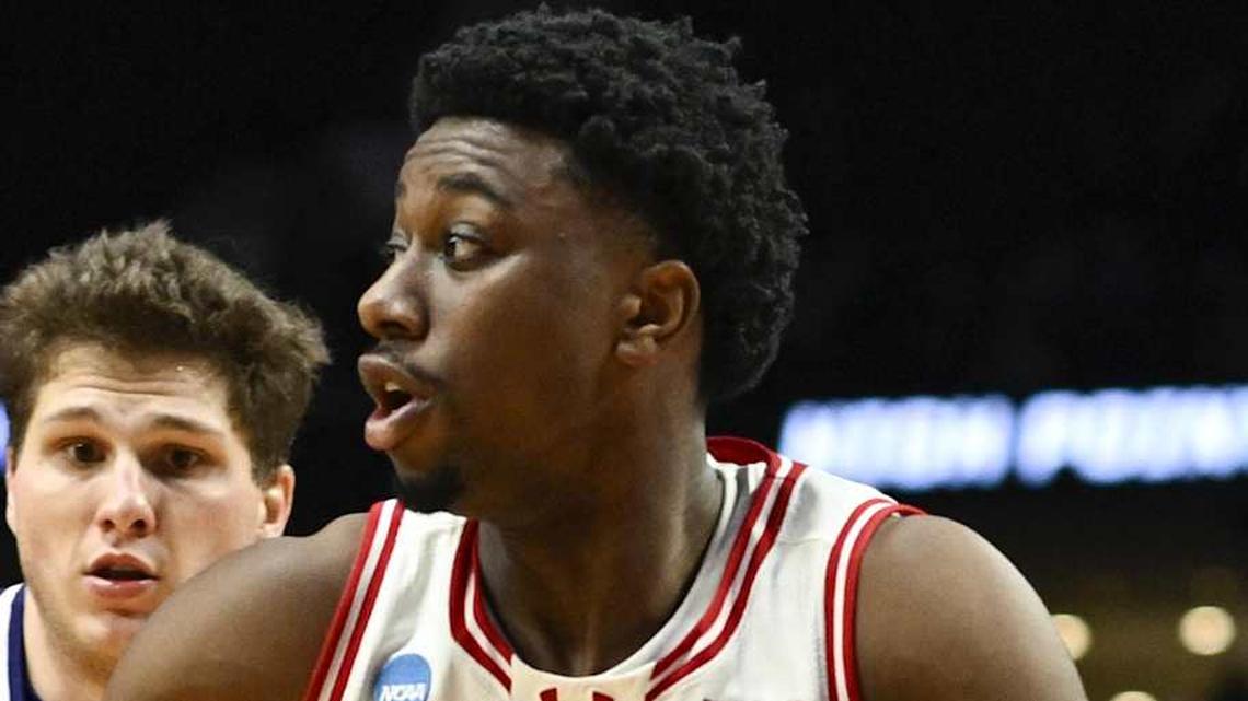  Mar 19, 2026; Portland, OR, USA; Wisconsin Badgers guard John Blackwell (25) drives to the basket against High Point Panthers guard Chase Johnston (99) during the second half of a first round game of the men's 2026 NCAA Tournament at Moda Center. Mandatory Credit: Troy Wayrynen-Imagn Images | Troy Wayrynen-Imagn Images 