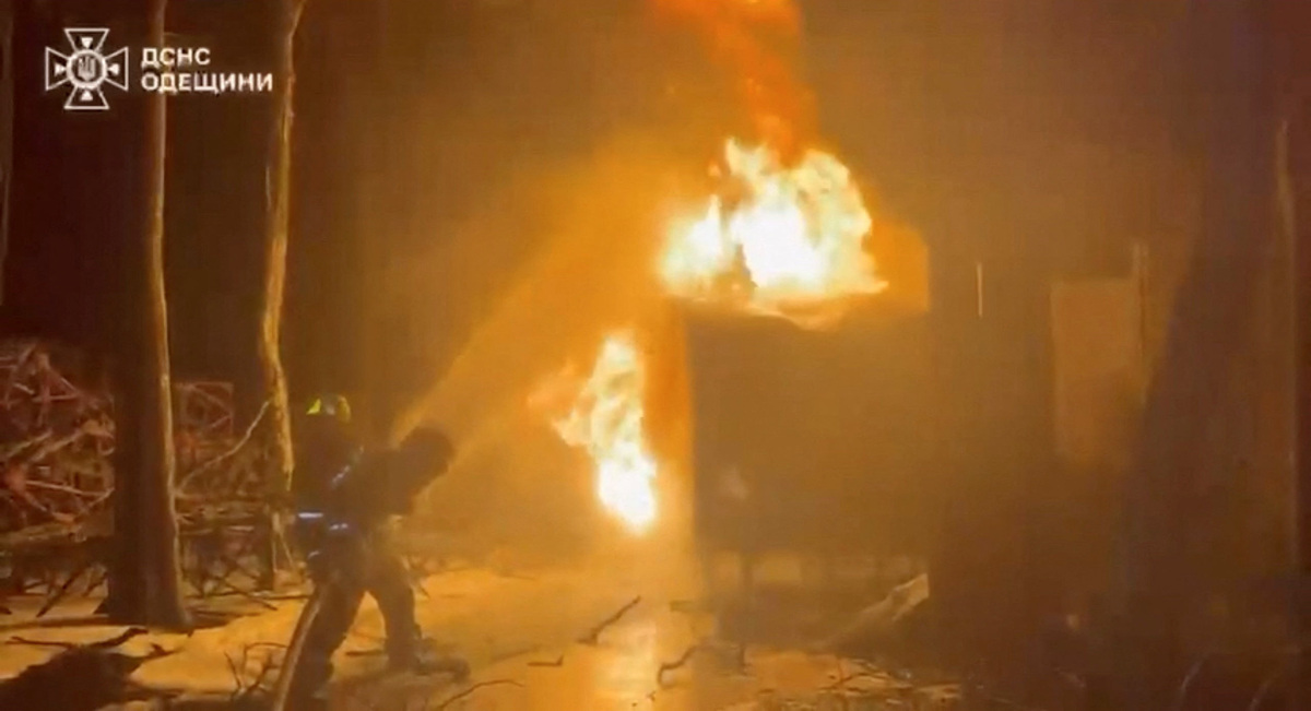 A firefighter attempts to put out a fire after a Russian strike, amid Russia's attack on Ukraine, at a location given as Odesa Region, Ukraine, in this still image from video released June 22, 2026.    State Emergency Service of Ukraine in Odesa Region/Handout via REUTERS