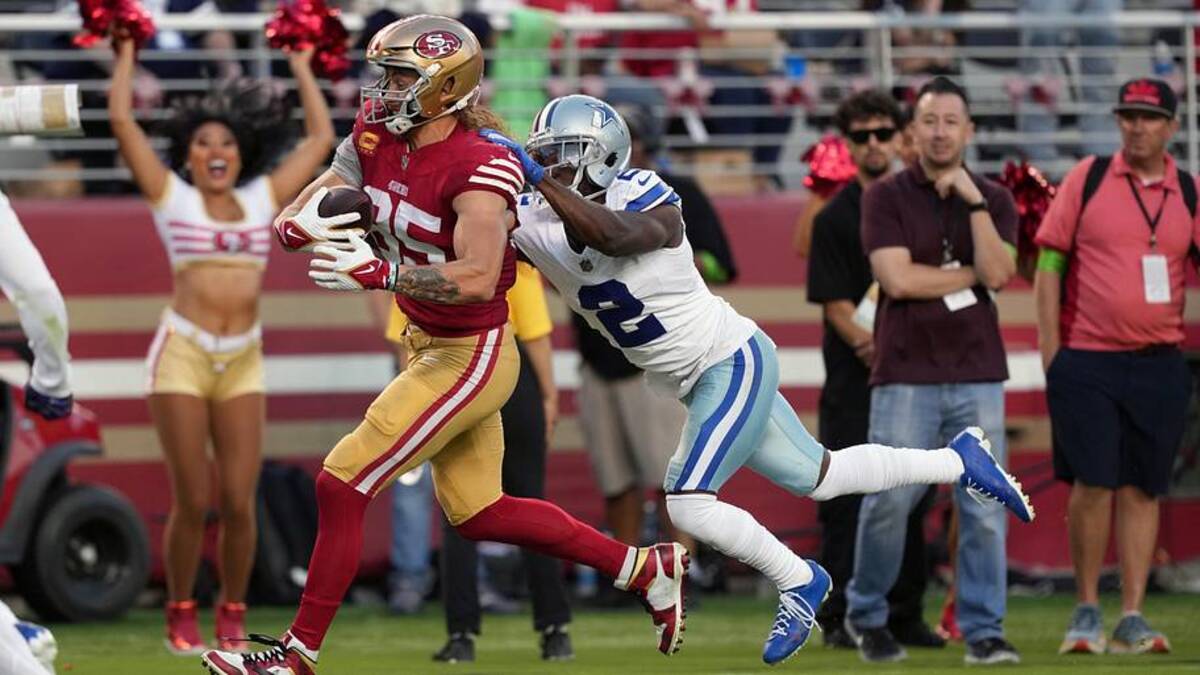  Oct 8, 2023; Santa Clara, California, USA; San Francisco 49ers tight end George Kittle (85) runs after a catch against Dallas Cowboys cornerback Jourdan Lewis (2) during the second quarter at Levi's Stadium. Mandatory Credit: Darren Yamashita-Imagn Images | Darren Yamashita-Imagn Images 