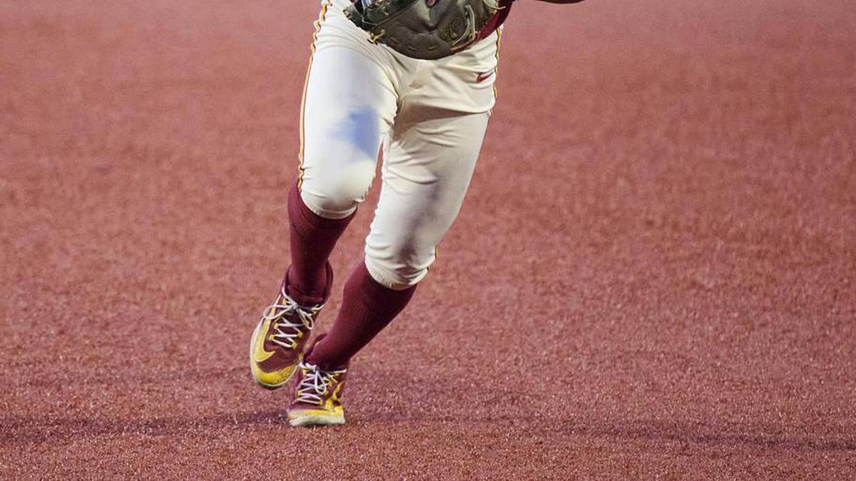  May 31, 2025; Corvallis, OR, USA; USC infielder Adrian Lopez (5) waves off a teammate as he tags first base during the ninth inning against Saint Mary's at Goss Stadium. Mandatory Credit: Troy Wayrynen-Imagn Images | Troy Wayrynen-Imagn Images 