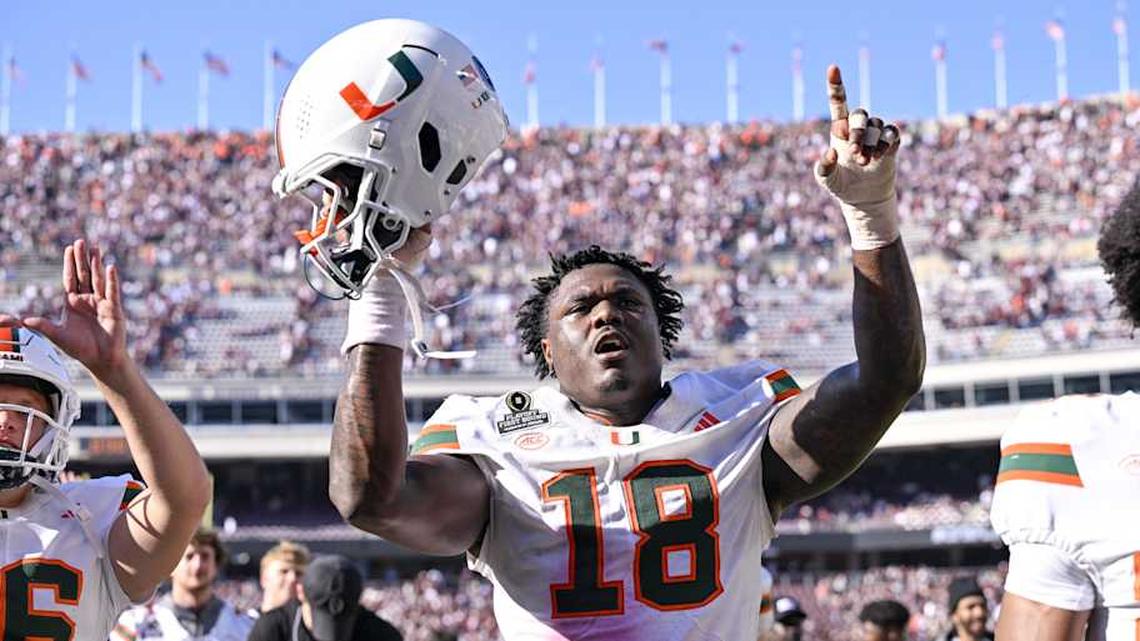  Dec 20, 2025; College Station, TX, USA; Miami Hurricanes defensive lineman Armondo Blount (18) holds up his helmet as he celebrates the Hurricanes win over the Texas A&M Aggies at Kyle Field. Mandatory Credit: Jerome Miron-Imagn Images | Jerome Miron-Imagn Images 