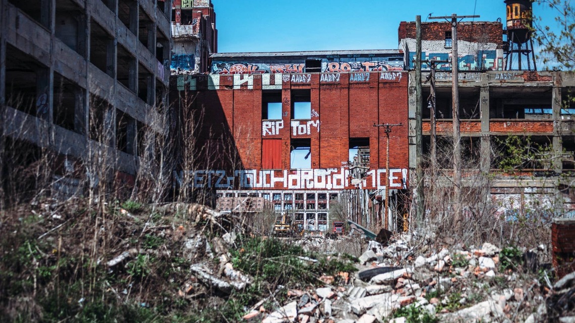 Detroit's Packard Plant drew a $6 million top bid in 2013; after two buyers defaulted, it sold for $405,000 
