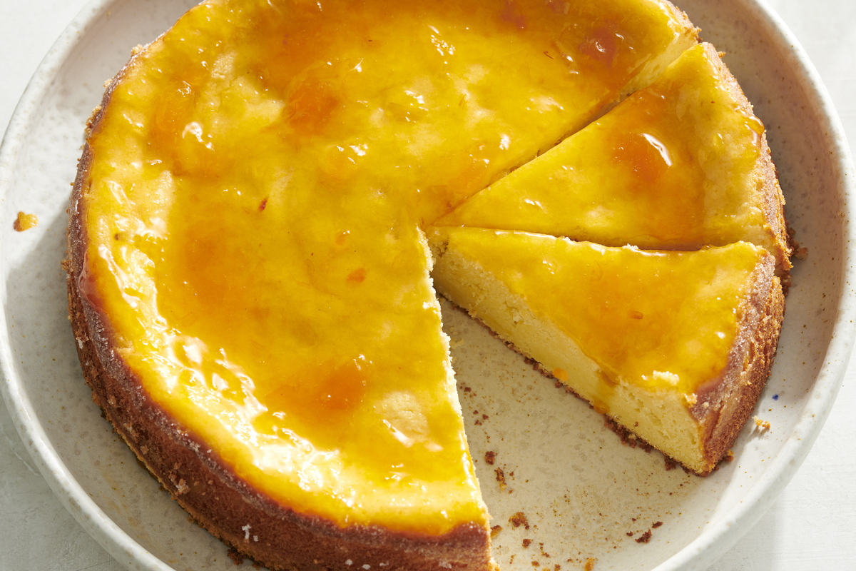 Lemon ricotta cake. This easy lemony cake is topped with apricot preserves, which gives an especially sunny presentation. Food styled by Cyd Raftus McDowell. (David Malosh/The New York Times)