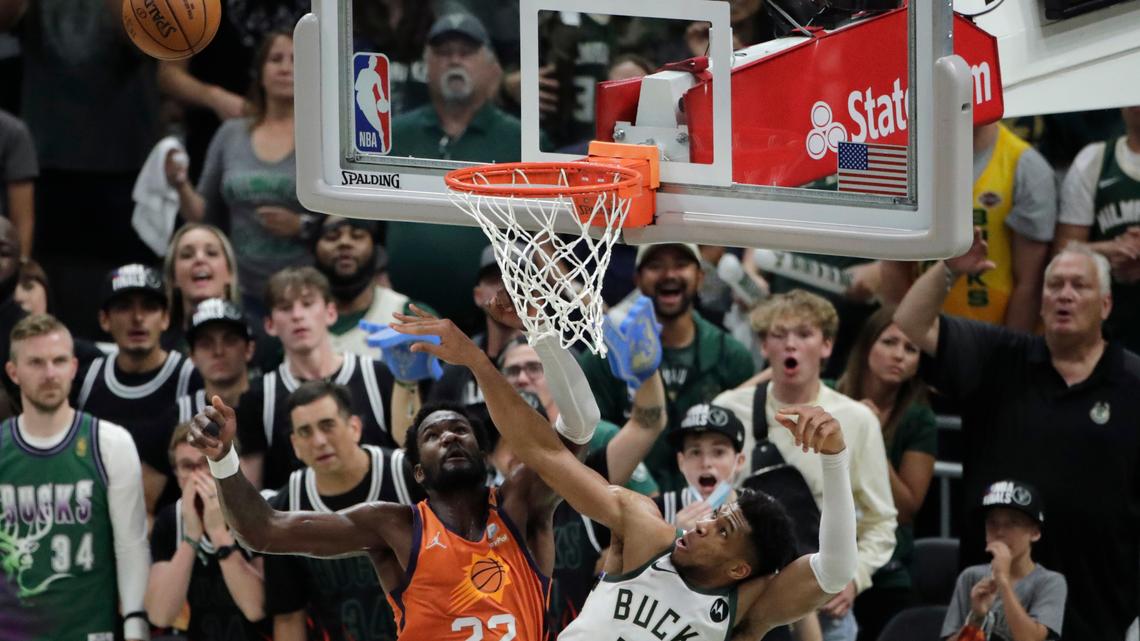 Milwaukee Bucks forward Giannis Antetokounmpo (34) blocks a shot by Phoenix Suns center Deandre Ayton (22) during the second half of Game 4 of basketball’s NBA Finals Wednesday, July 14, 2021, in Milwaukee. (AP Photo/Aaron Gash)