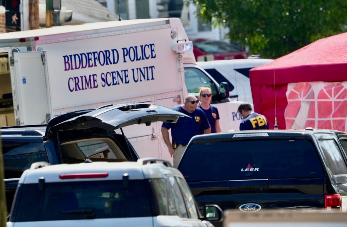 Investigators are seen in Biddeford, Maine July 13, 2026 following reports of a fatal shooting.