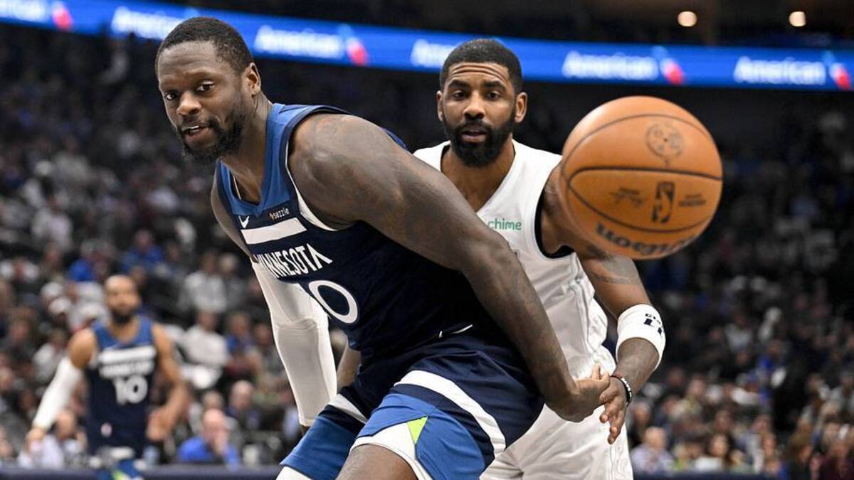  Jan 22, 2025; Dallas, Texas, USA; Minnesota Timberwolves forward Julius Randle (30) and Dallas Mavericks guard Kyrie Irving (11) look for the loose ball during the first quarter at the American Airlines Center. | Jerome Miron-Imagn Images 