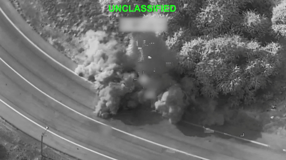 Smoke rises following a strike at an unknown location during what the U.S. military says is its latest wave of strikes on Iran, hitting "military targets such as coastal surveillance and air defense sites, military logistics infrastructure, and maritime capabilities," in this still image taken from a handout video released on Thursday.