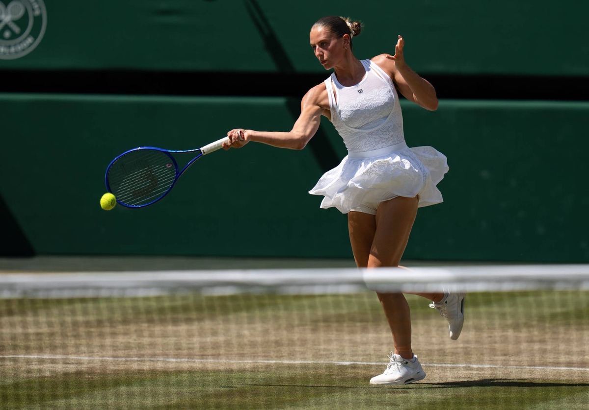  Jul 8, 2026; London, United Kingdom; Marta Kostyuk of Ukraine returns a shot during her match against Jasmine Paolini of Italy on day 10 at All England Lawn Tennis and Croquet Club. Mandatory Credit: Susan Mullane-Imagn Images 