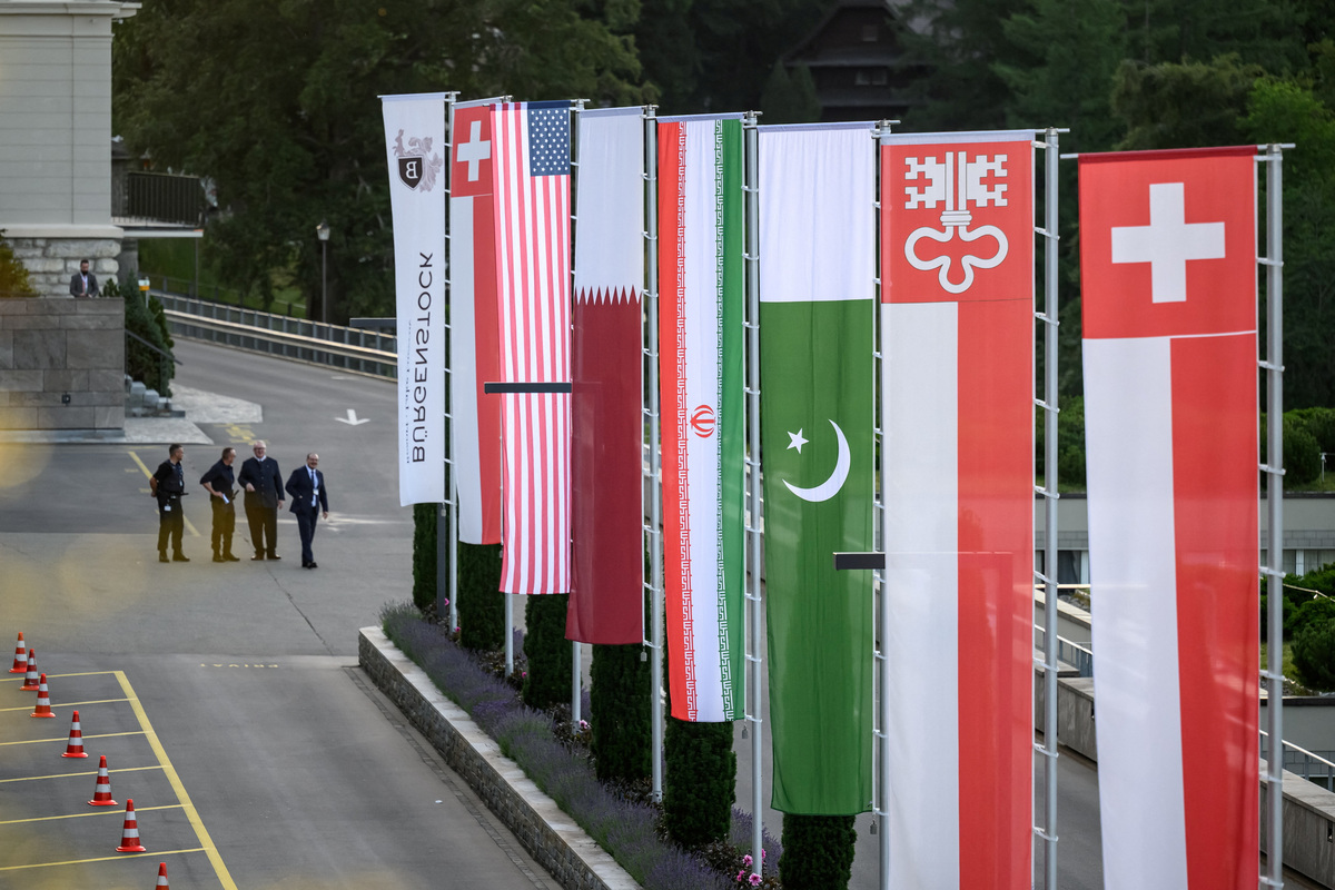 Flags of Switzerland, the United States, Qatar, Pakistan and the local Swiss canton of Nidwalden are photographed at the Burgenstock luxury hotel complex overlooking Lake Lucerne, Switzerland, on June 21, 2026, ahead of high-level talks aimed at advancing a deal to end the Middle East conflict.  Fabrice Coffrini/Pool via REUTERS