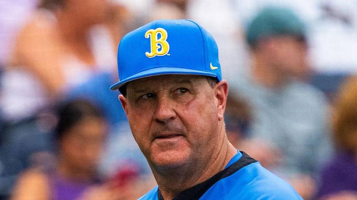  Jun 16, 2025; Omaha, Neb, USA; UCLA Bruins head coach John Savage walks off the field before the game against the LSU Tigers at Charles Schwab Field. Mandatory Credit: Dylan Widger-Imagn Images | Dylan Widger-Imagn Images 