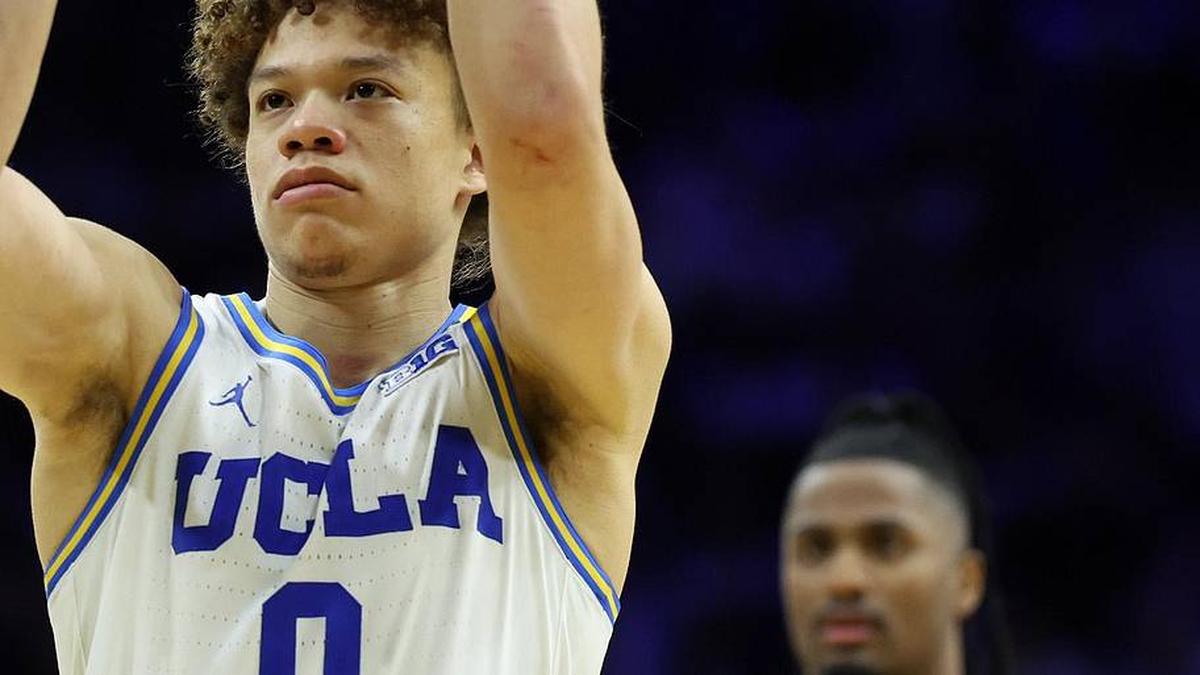  Mar 20, 2026; Philadelphia, PA, USA; UCLA Bruins guard Trent Perry (0) shoots the ball in the second half during a first round game of the men's 2026 NCAA Tournament at Xfinity Mobile Arena. Mandatory Credit: Bill Streicher-Imagn Images | Bill Streicher-Imagn Images 