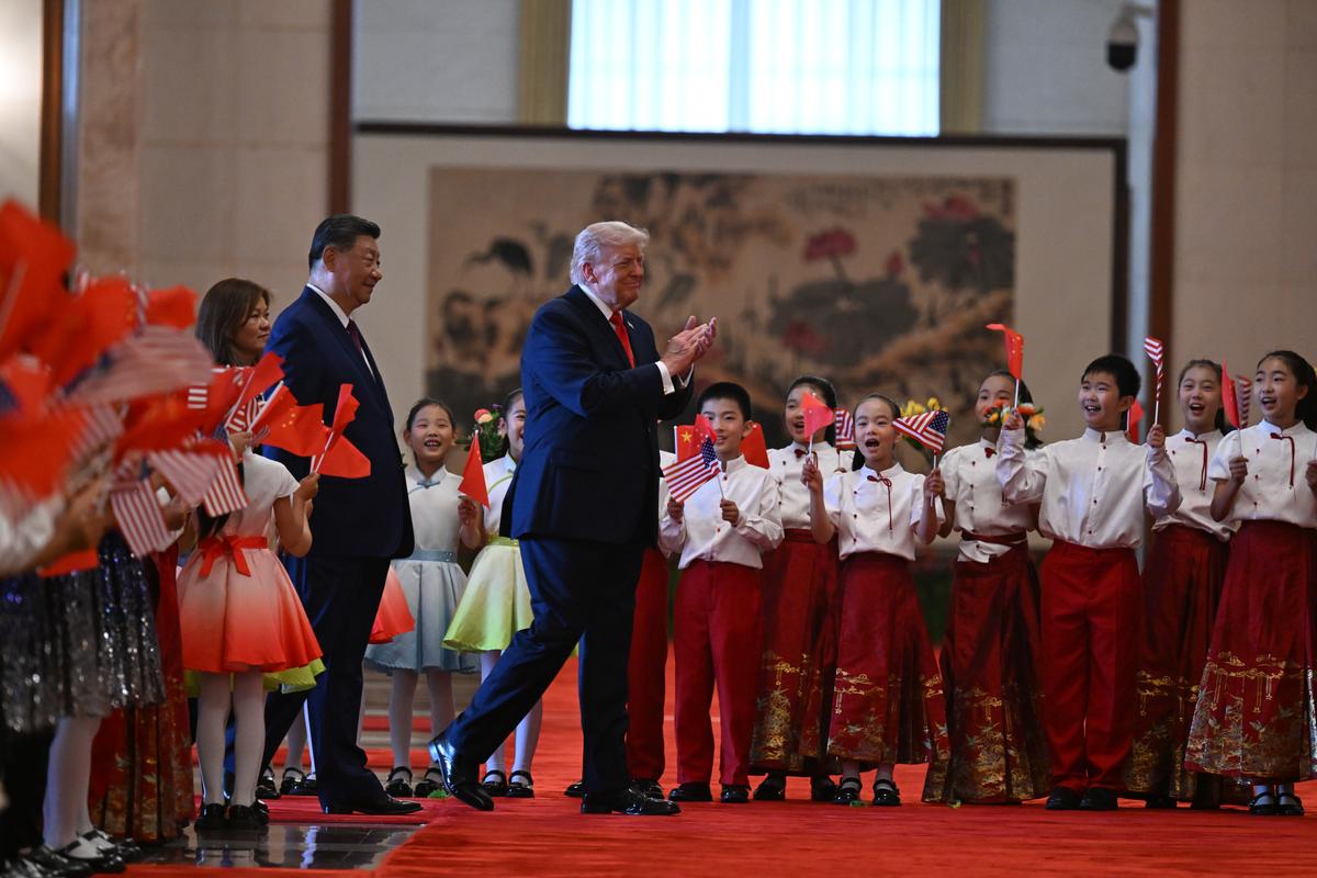 Children welcome President Xi Jinping of China and President Donald Trump inside the Great Hall of the People in Beijing during their two-day summit, on Thursday, May 14, 2026. During the first U.S. presidential visit to China in nearly a decade, Xi delivered a warning on Taiwan, saying that the issue, if handled poorly, could lead to conflict and "an extremely dangerous situation." (Kenny Holston/The New York Times)..